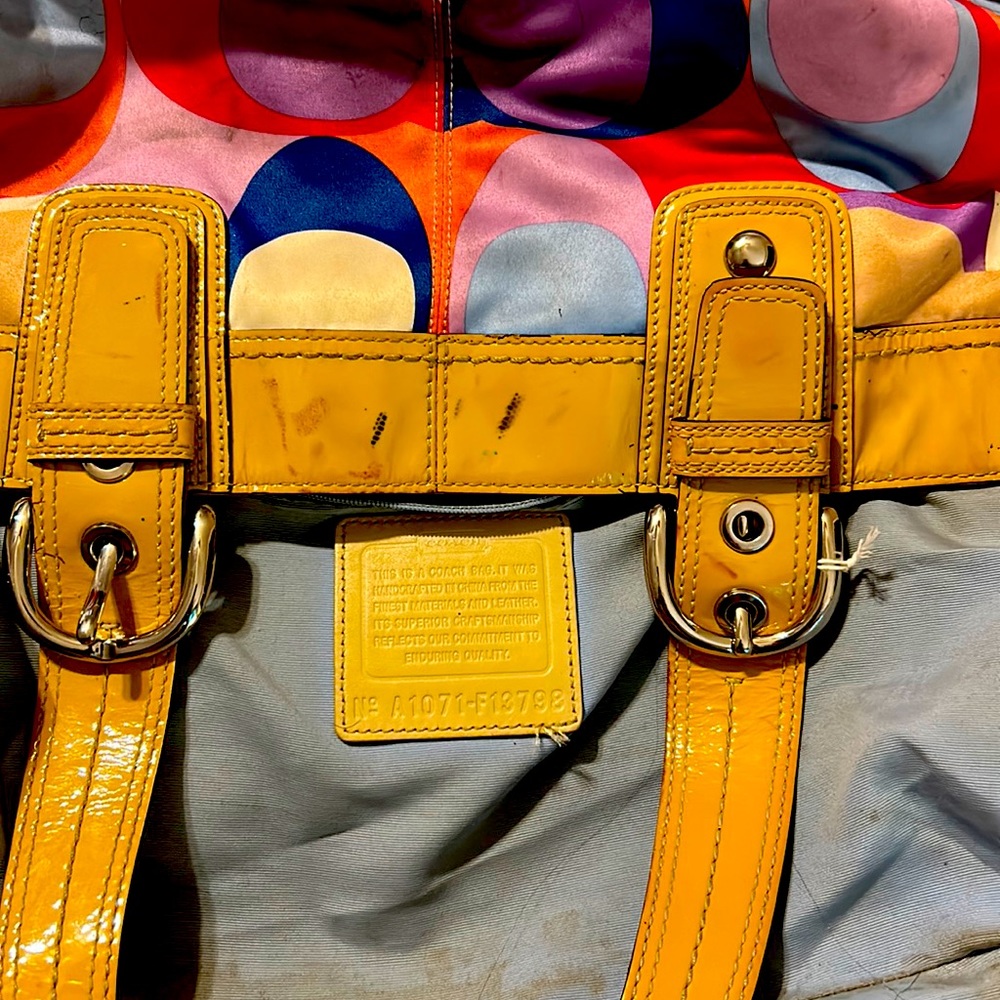 Used coach bag with some minor makeup spots.